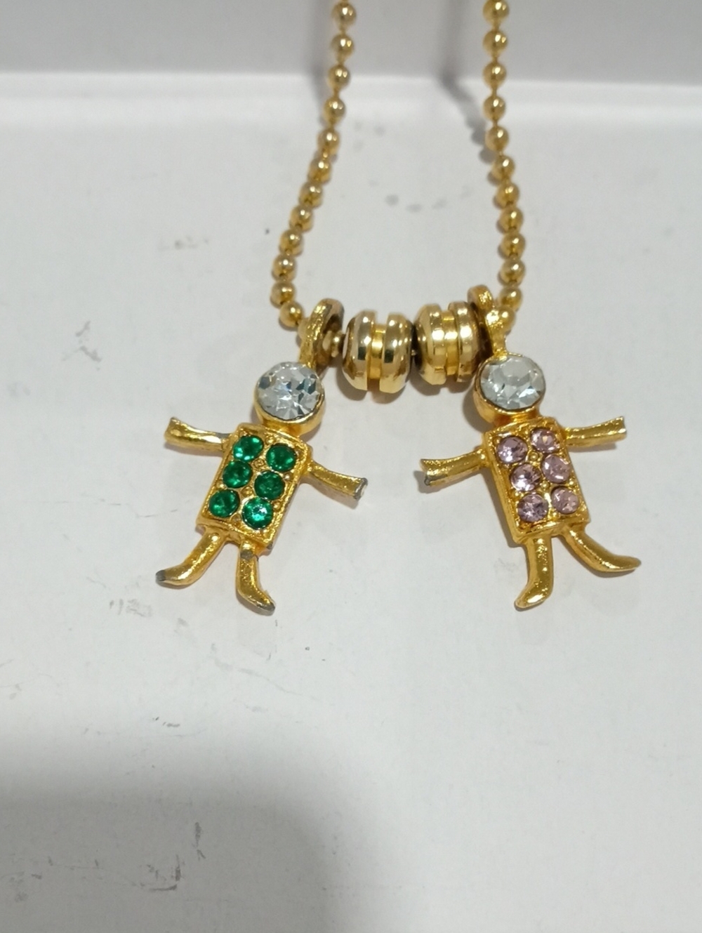 Brats USA KIS Gold Tone Double Girl Pendant Necklace with Green and Pink Stones